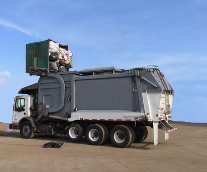 Waste removal team at work in Lewisham, showing company vehicles