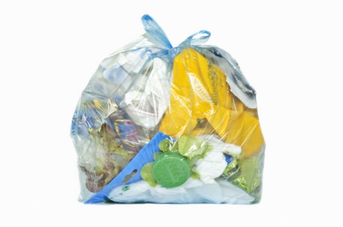 Operatives handling commercial waste with protective gear