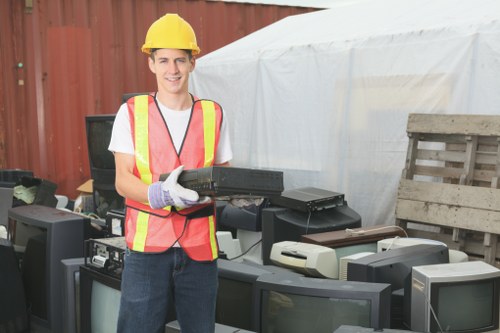 Crew member preparing spill kit and PPE before collection